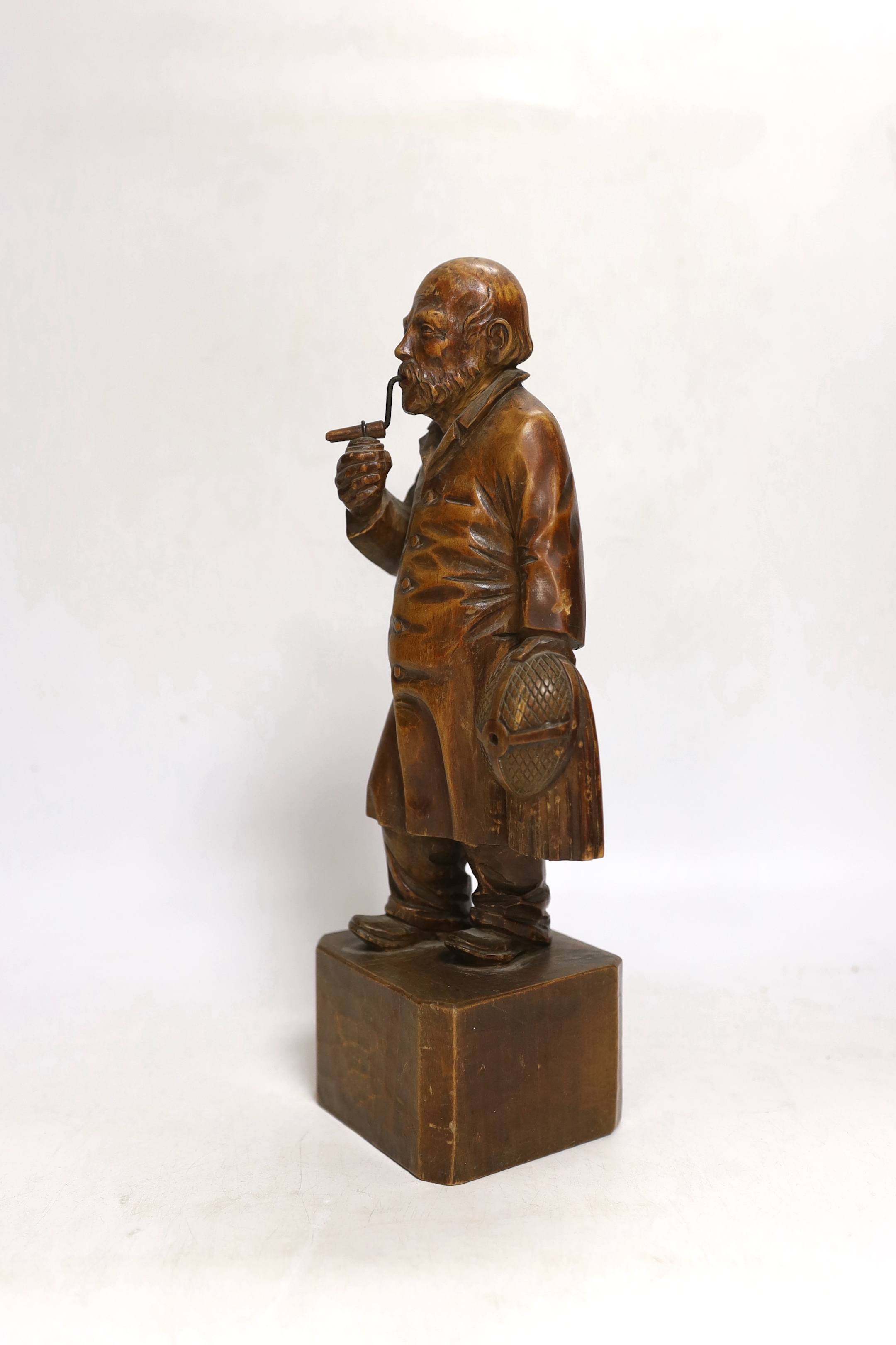 A German carved wood figure of a man, 28cm